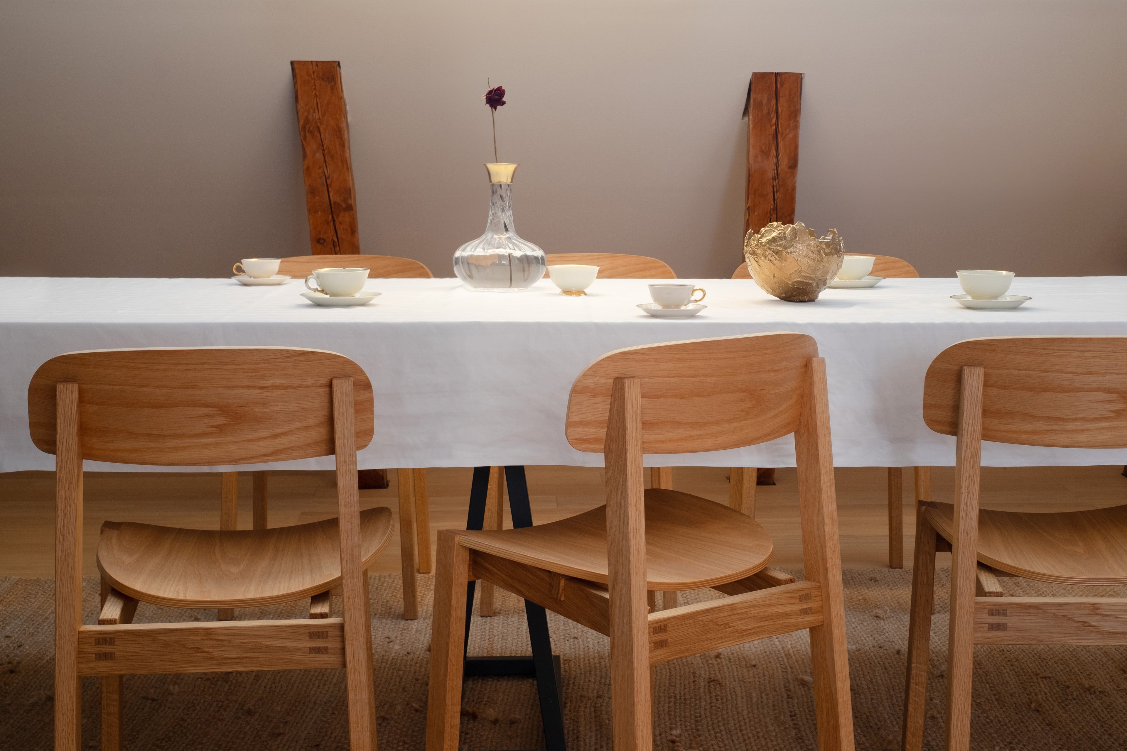 Siirto Chairs in a dining table setting, bringing Nordic elegance and comfort to a modern dining space.