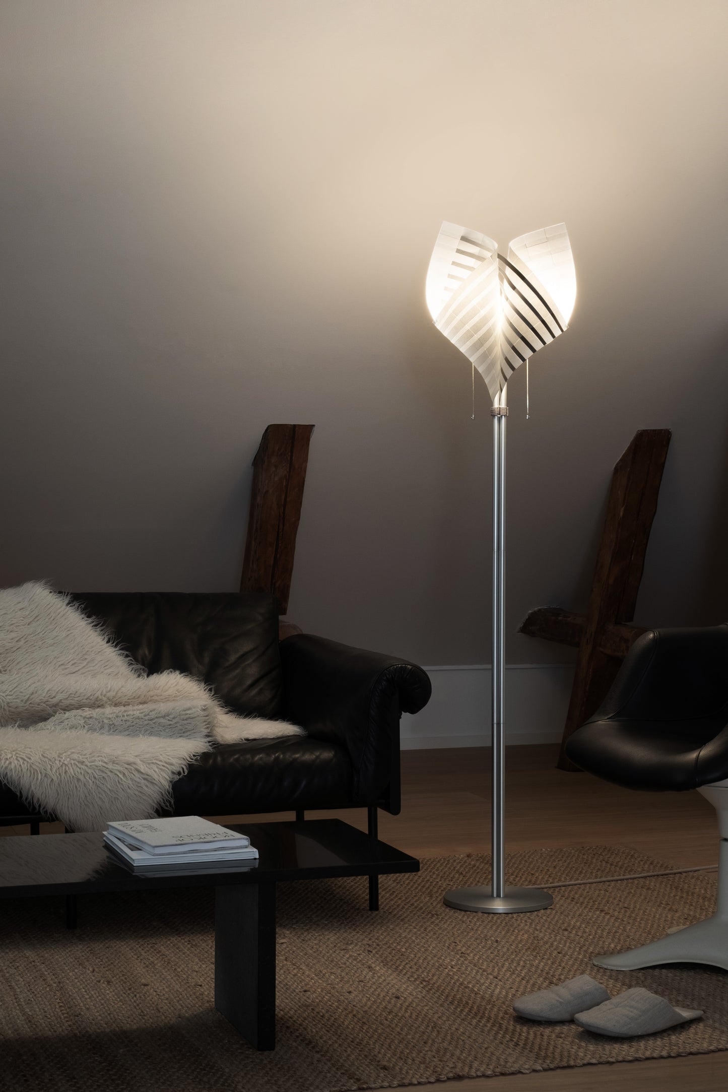 Close-up of TEX001 floor lamp details, highlighting the delicate pull chain switch, translucent lamp holder, and sculptural handwoven paper lampshade.
