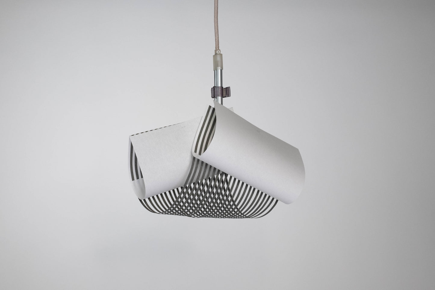TEX003 pendant lamp in a modern lounge corner with a bench sofa, enhancing the space with its sophisticated geometric design and creating a tranquil, refined atmosphere.