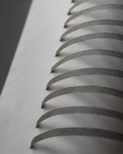 Close-up of the TEX002 lampshade, showcasing its intricate geometric design and neatly aligned stripes on the refined handwoven paper lampshade.